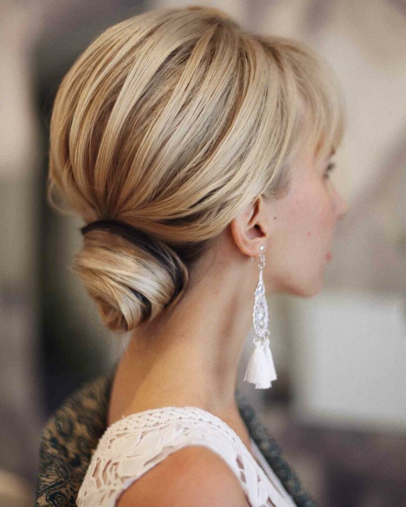 elegant low bun wedding hairstyle with pretty twist thin hair