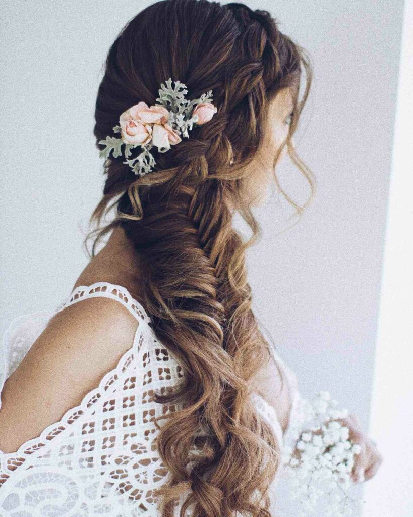 flower adorn fishtail braided wedding hairstyle ideas
