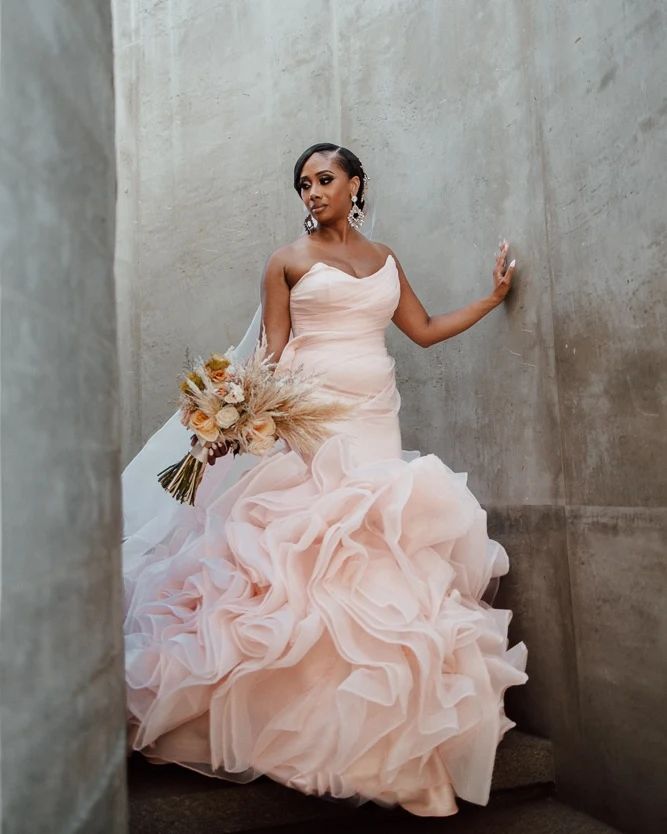 lesbian pink ball wedding gown with rustic wedding bouquet