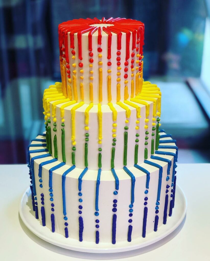 LGBT three tiered rainbow outdoor wedding cake