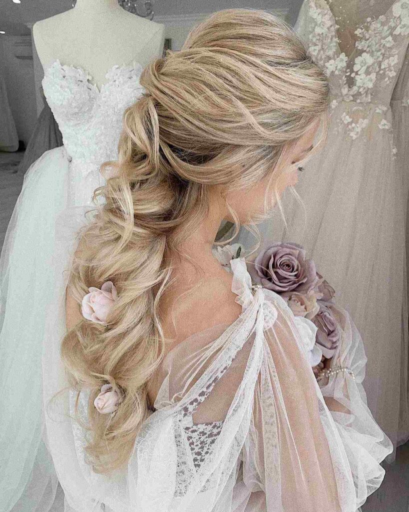 loose mermaid braided pink flower adorn wedding hairstyles