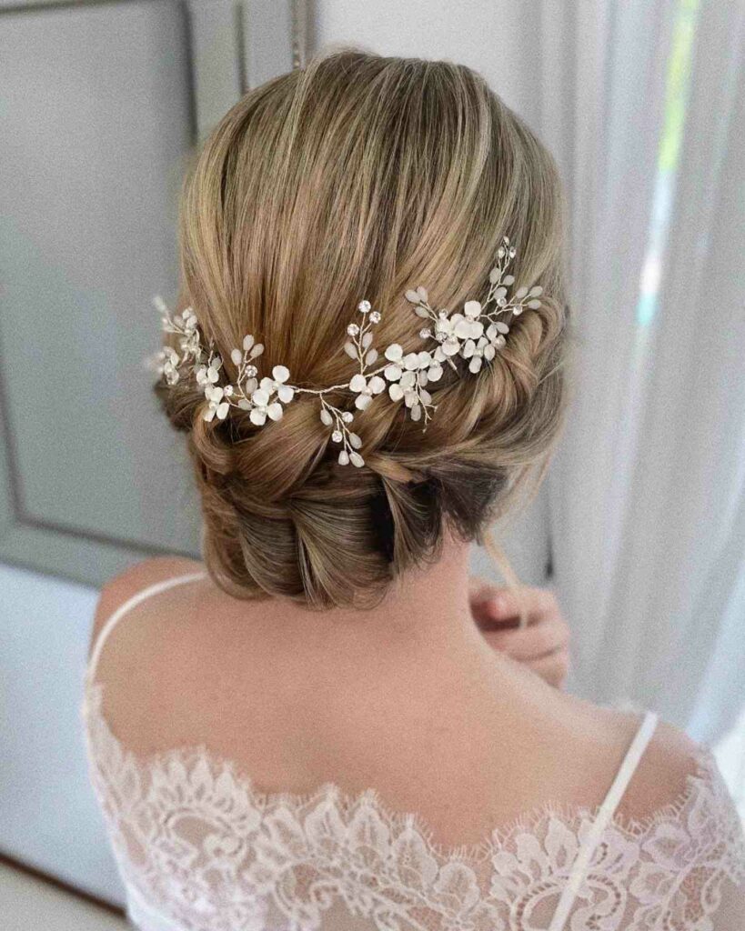 loose romantic hairstyle for wedding with braids and headpiece