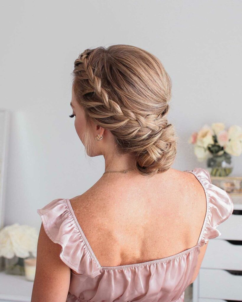 low bun wedding hairstyle with side braid