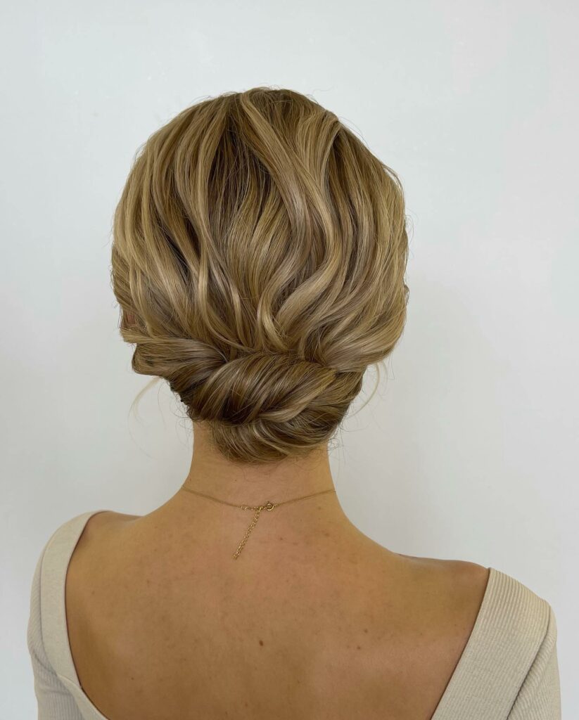 messy low bun mother of the bride thin hair wedding hairstyle