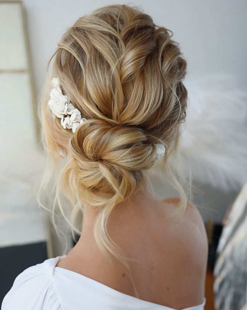messy wedding thin hair updo with hair piece