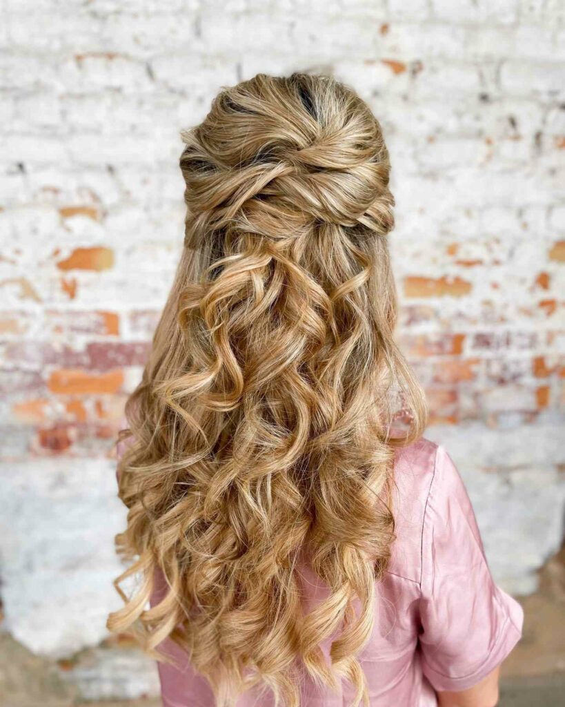 romantic half up bridesmaid hairstyle with bouncy curls