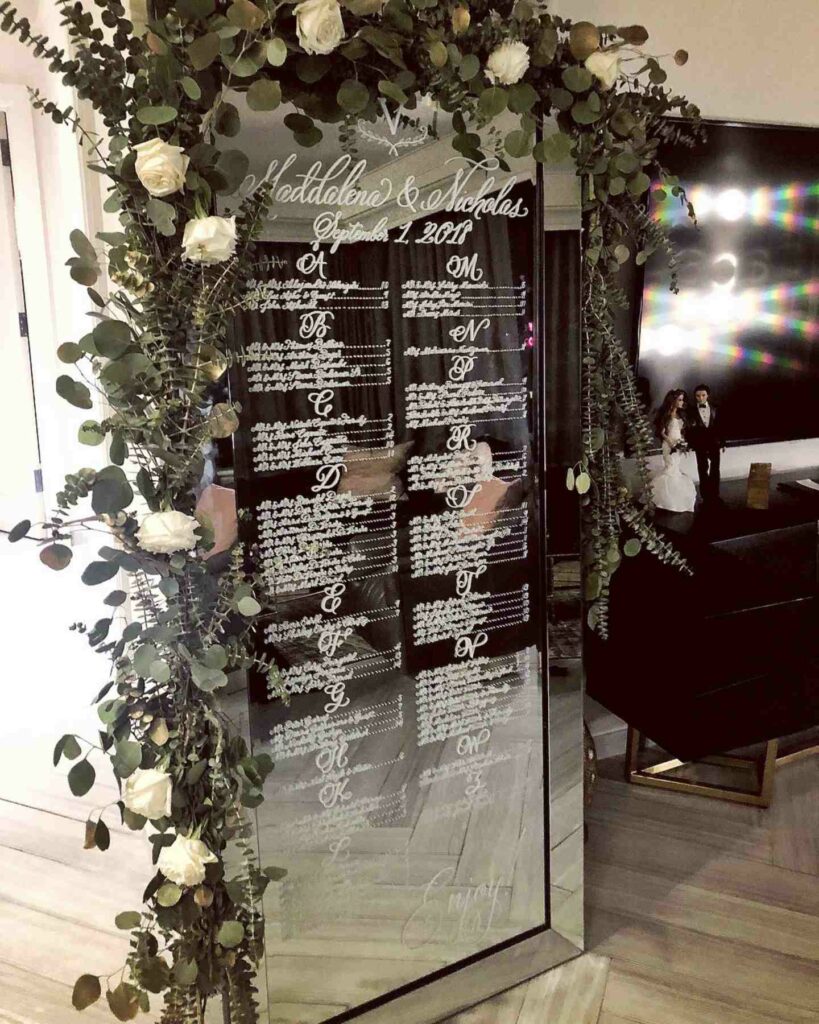 seating chart classy mirror wedding sign with greenery