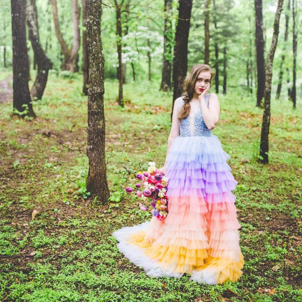 tulle pastel rainbow bridal dress with colorful bouquet