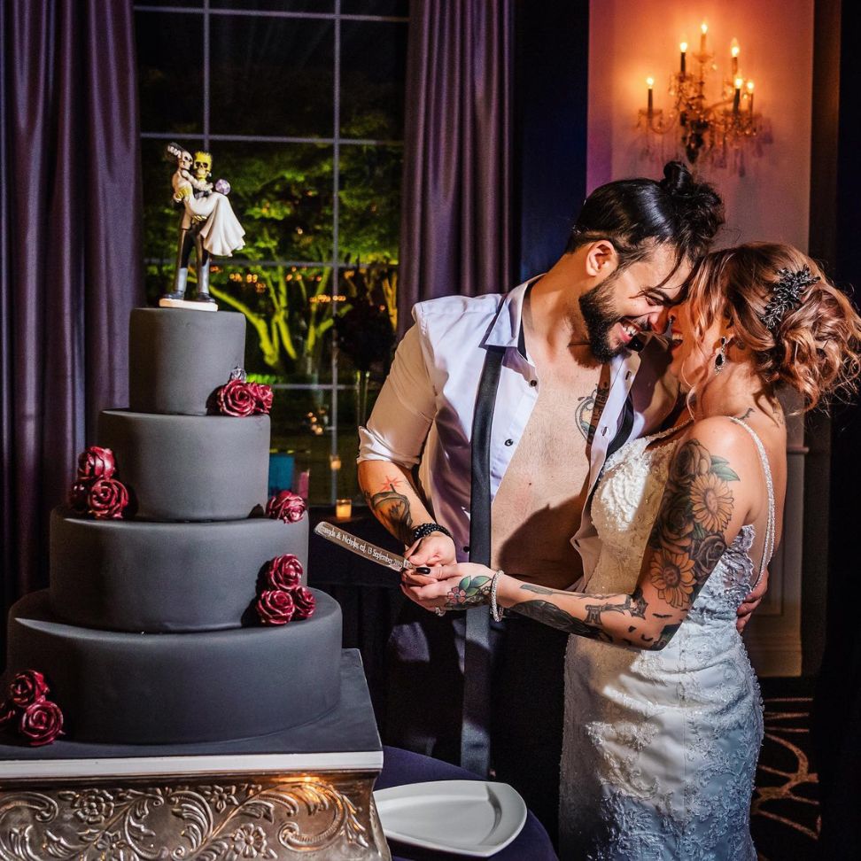 Halloween themed cake cutting wedding ceremony