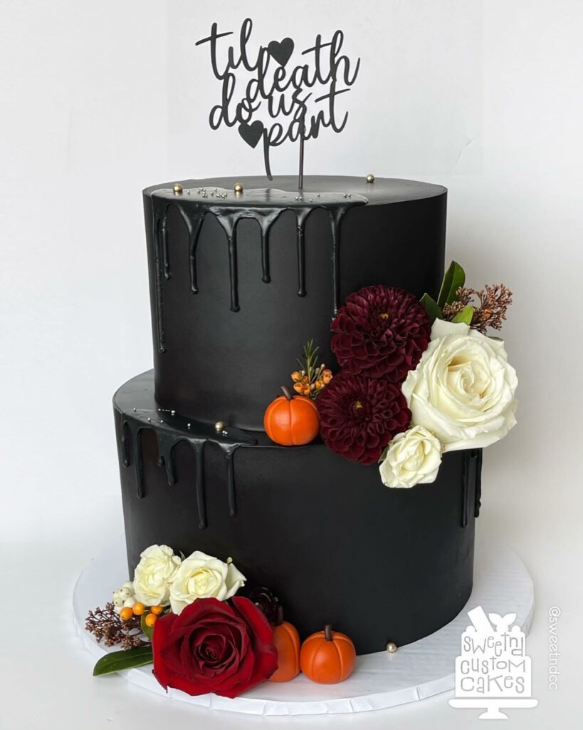 black gothic cake contrast with pumpkin and fall florals