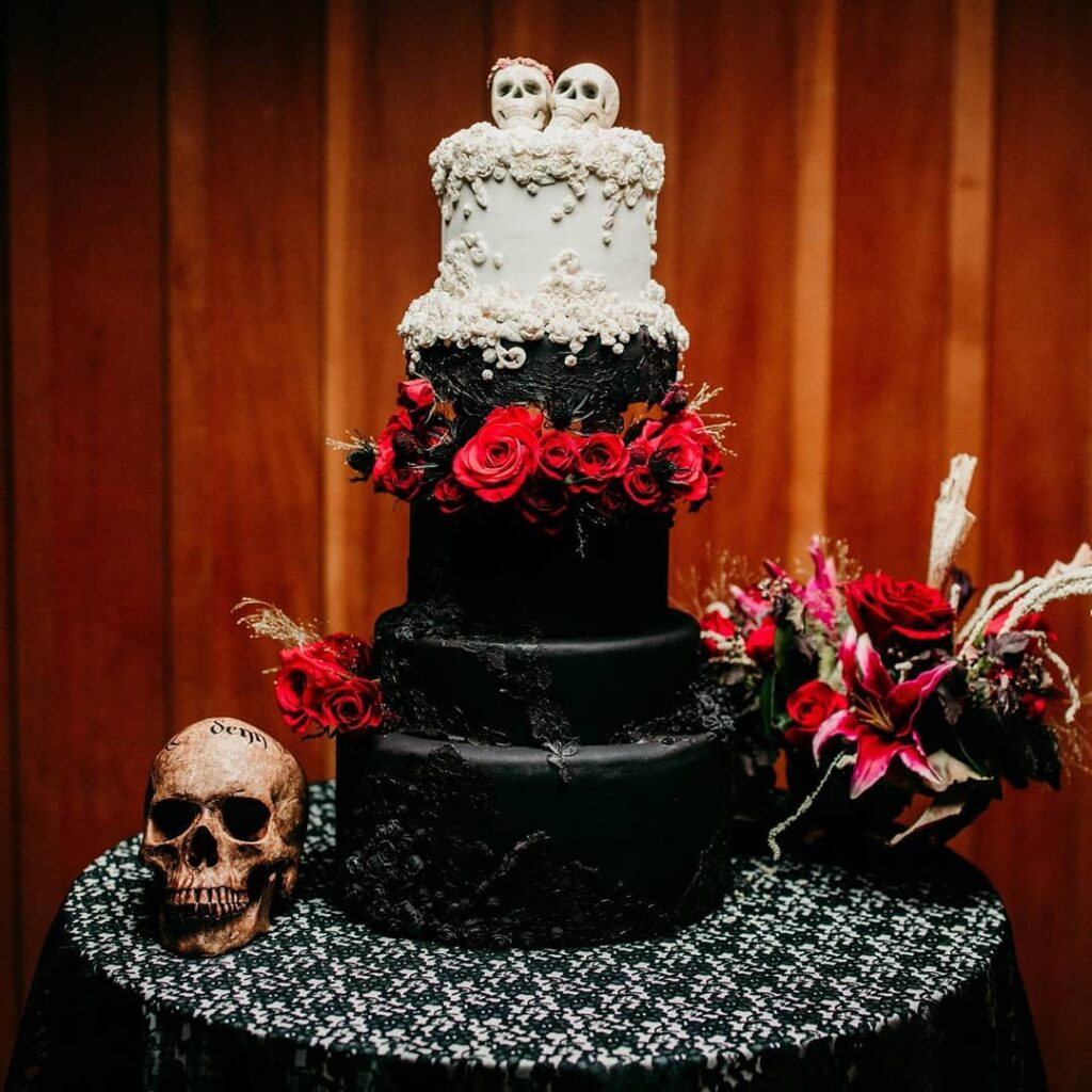 black gothic wedding cake with human skull art