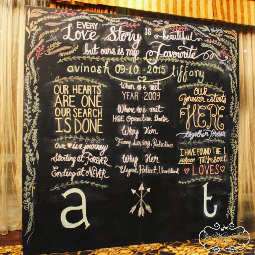 colorful chalkboard photo booth with written love story