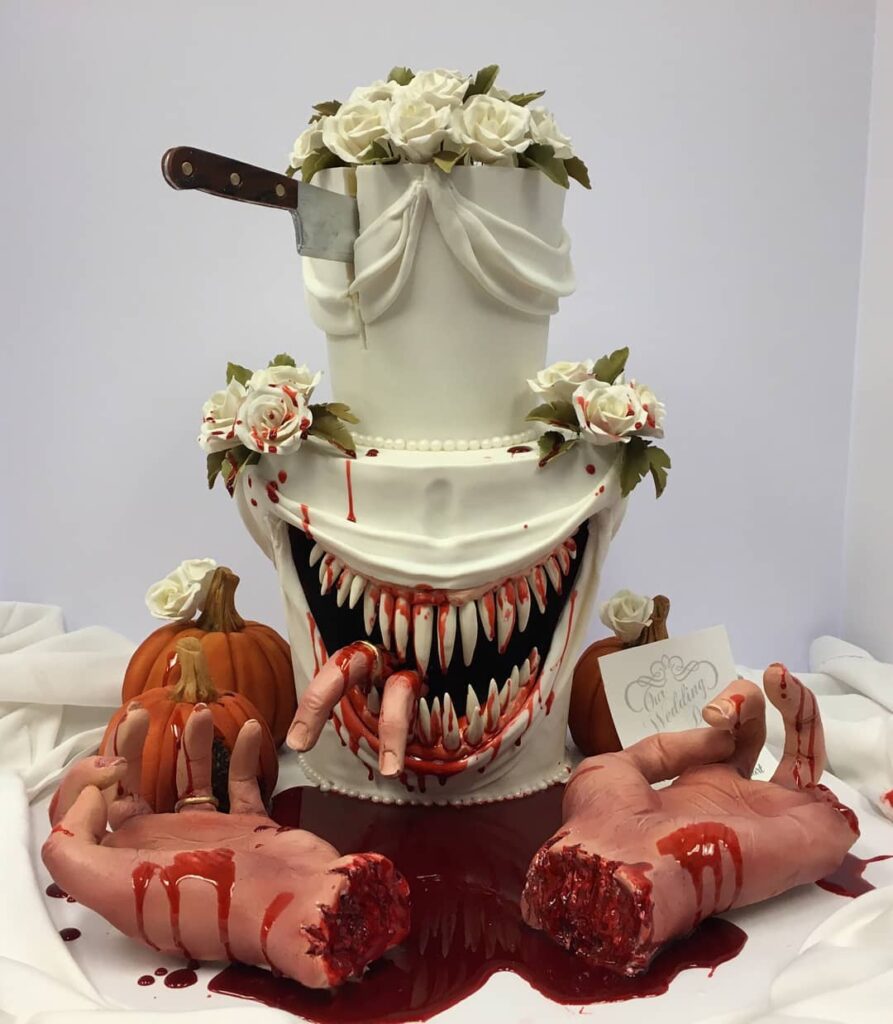 edible hand and knife Halloween wedding cake