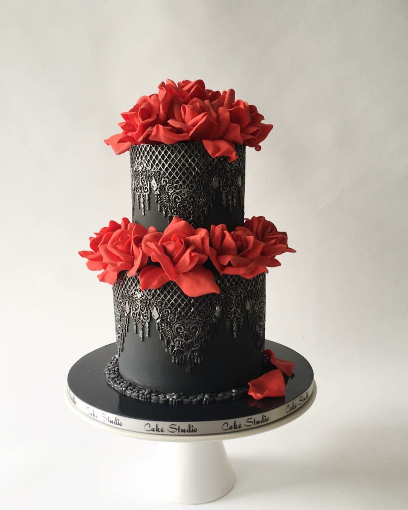 ornate chandelier black lace gothic cake with silver highlights and dark red sugar roses