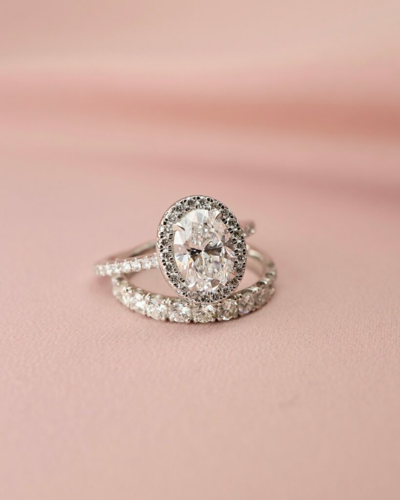 oval shaped halo engagement ring with diamond wedding band