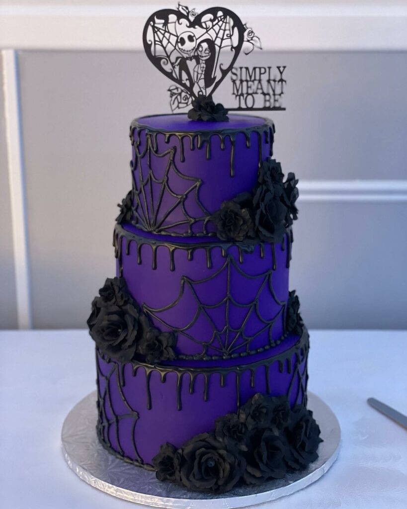 purple Halloween cake with piped spider and black roses