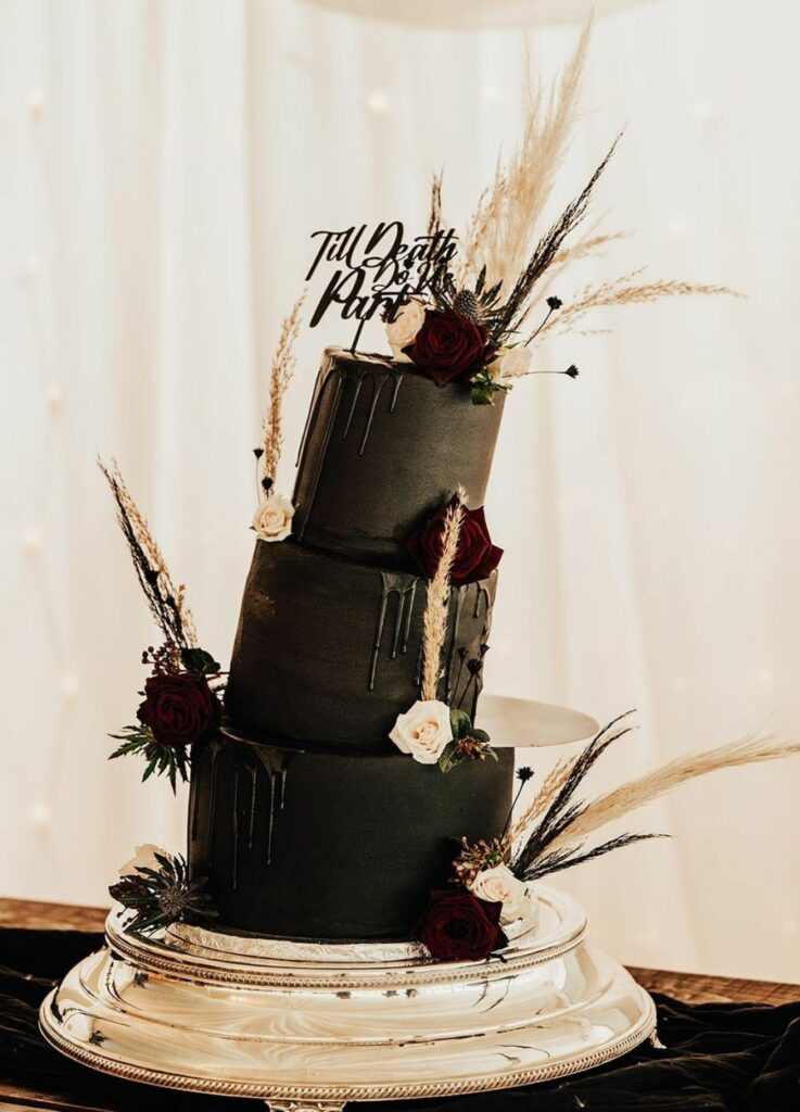 stunning gothic black wedding cake with topper