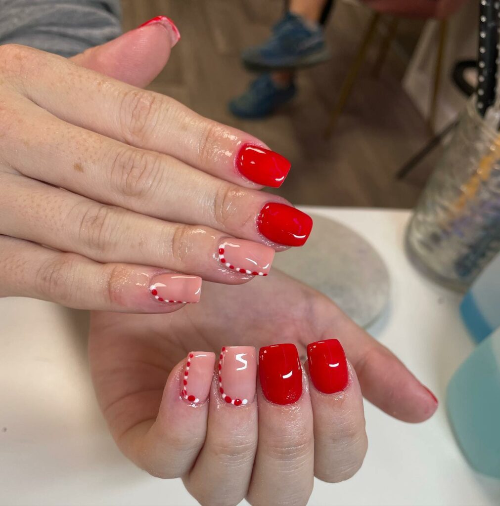 Candy cane delight red Christmas nails with sweet accents