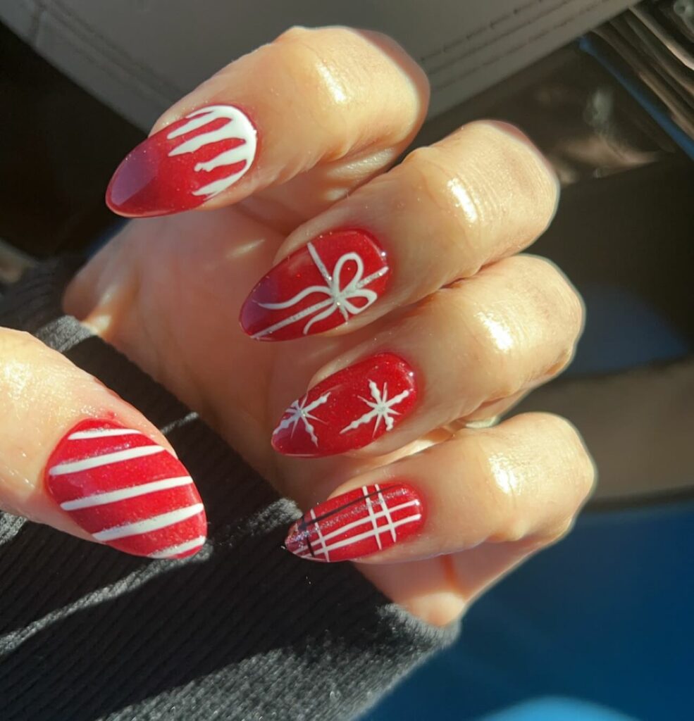Christmas candy cane stripe and snowflake nail design