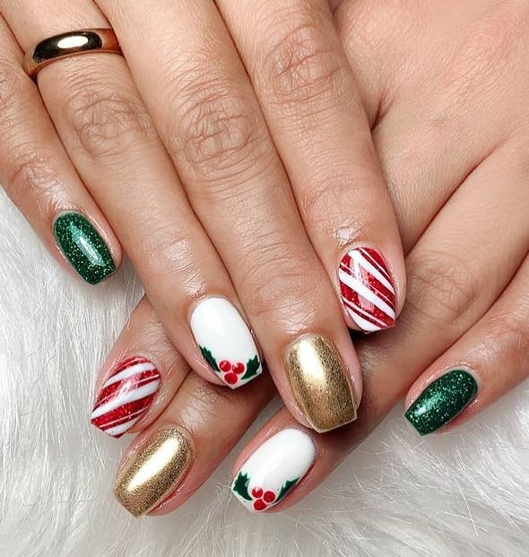 Christmas nail design with mix of traditional red and green the elegant candy cane stripes and a touch of festive gold