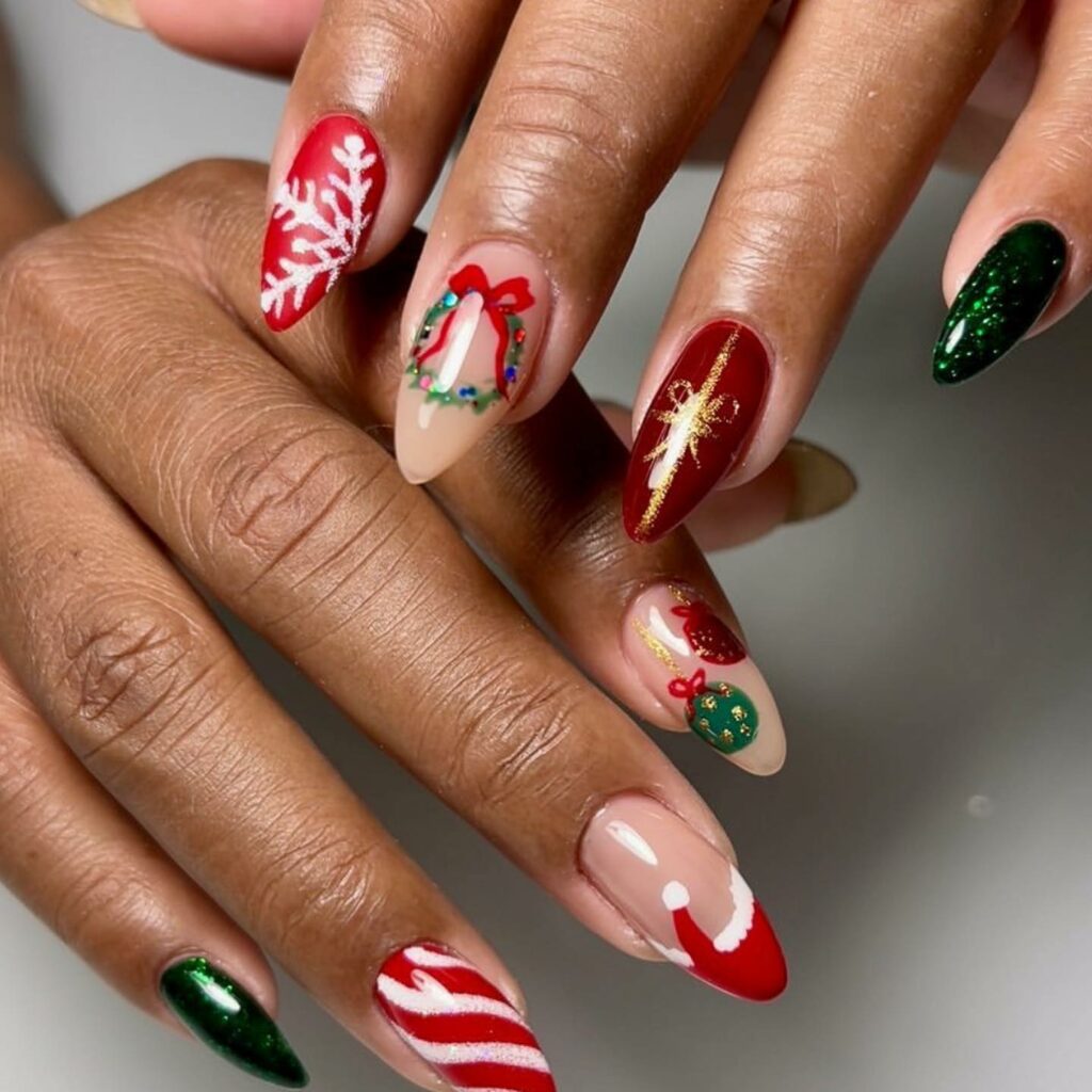 Christmas nails art with mistletoe holly berries and snowflakes set in a rich palette of red green and gold