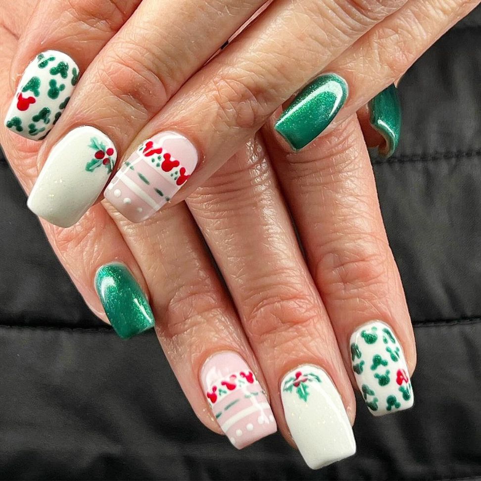 Christmas nails with holly leaves mistletoe and ornamental details in a joyful red and green colors