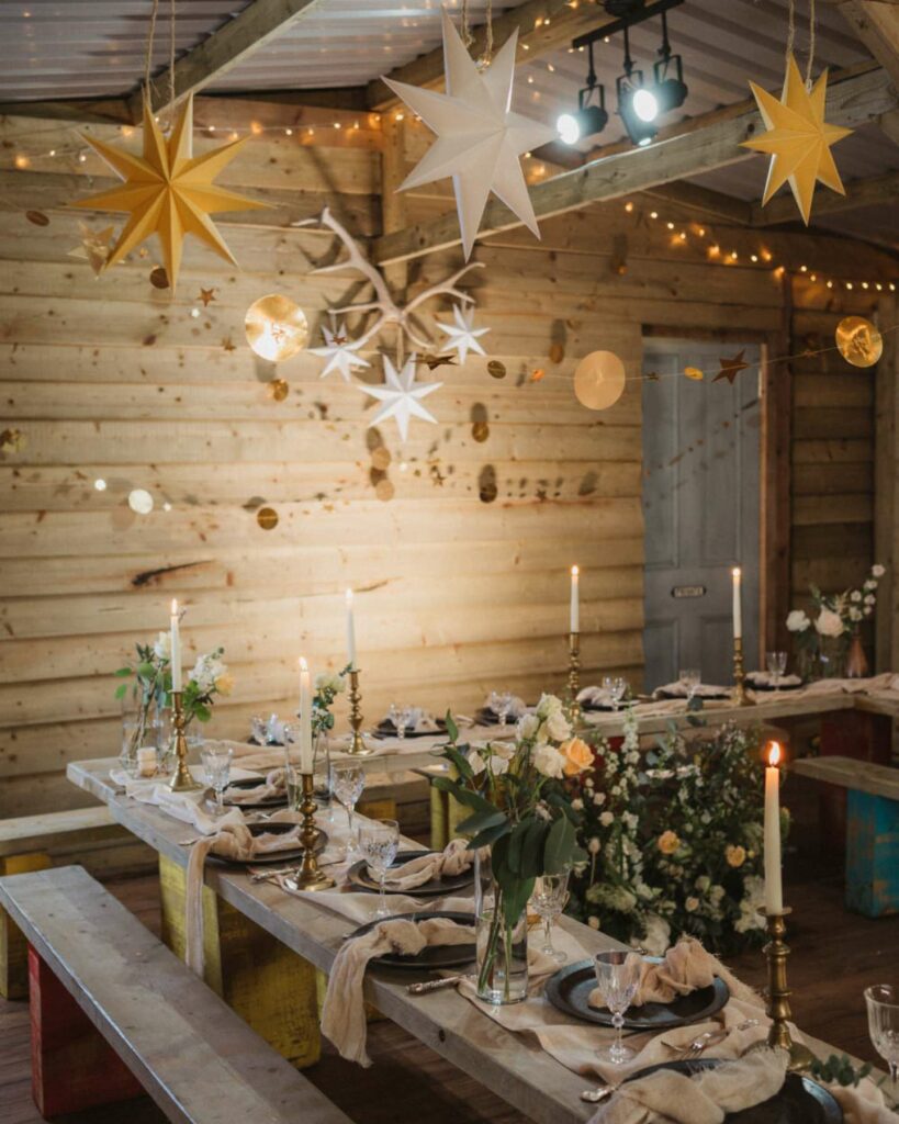 Christmas wedding reception decor with paper stars