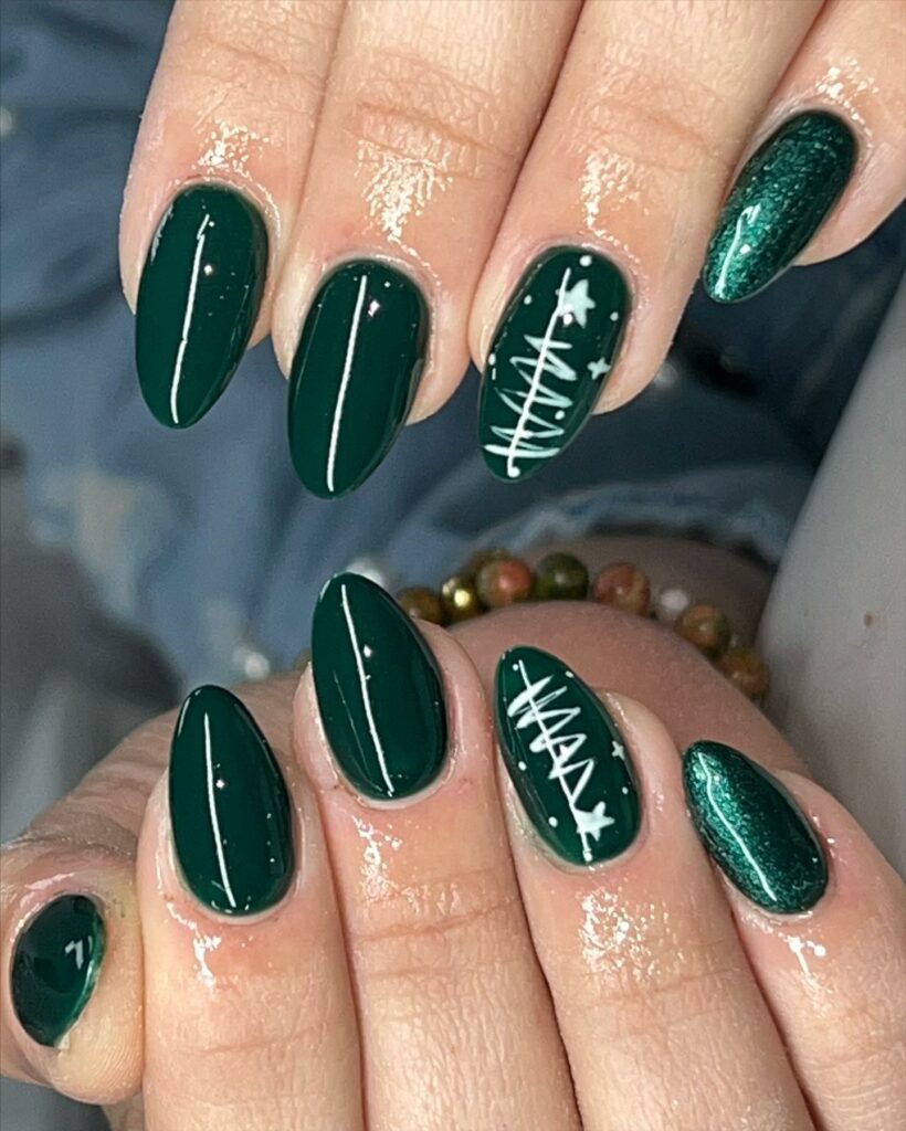Deep forest green nails with Christmas tree accents