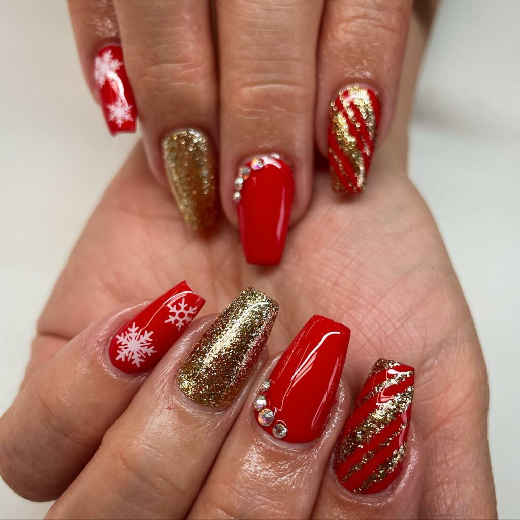 Gleaming festivity red and gold Christmas nails