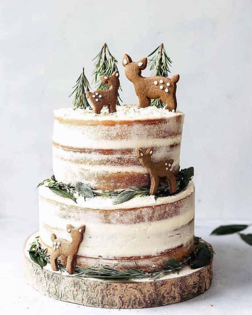 Naked winter rustic wonderland wedding cake with festive deer toppers