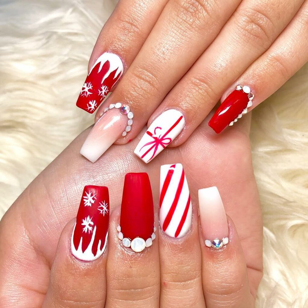 Red and white Christmas nail art with pearls