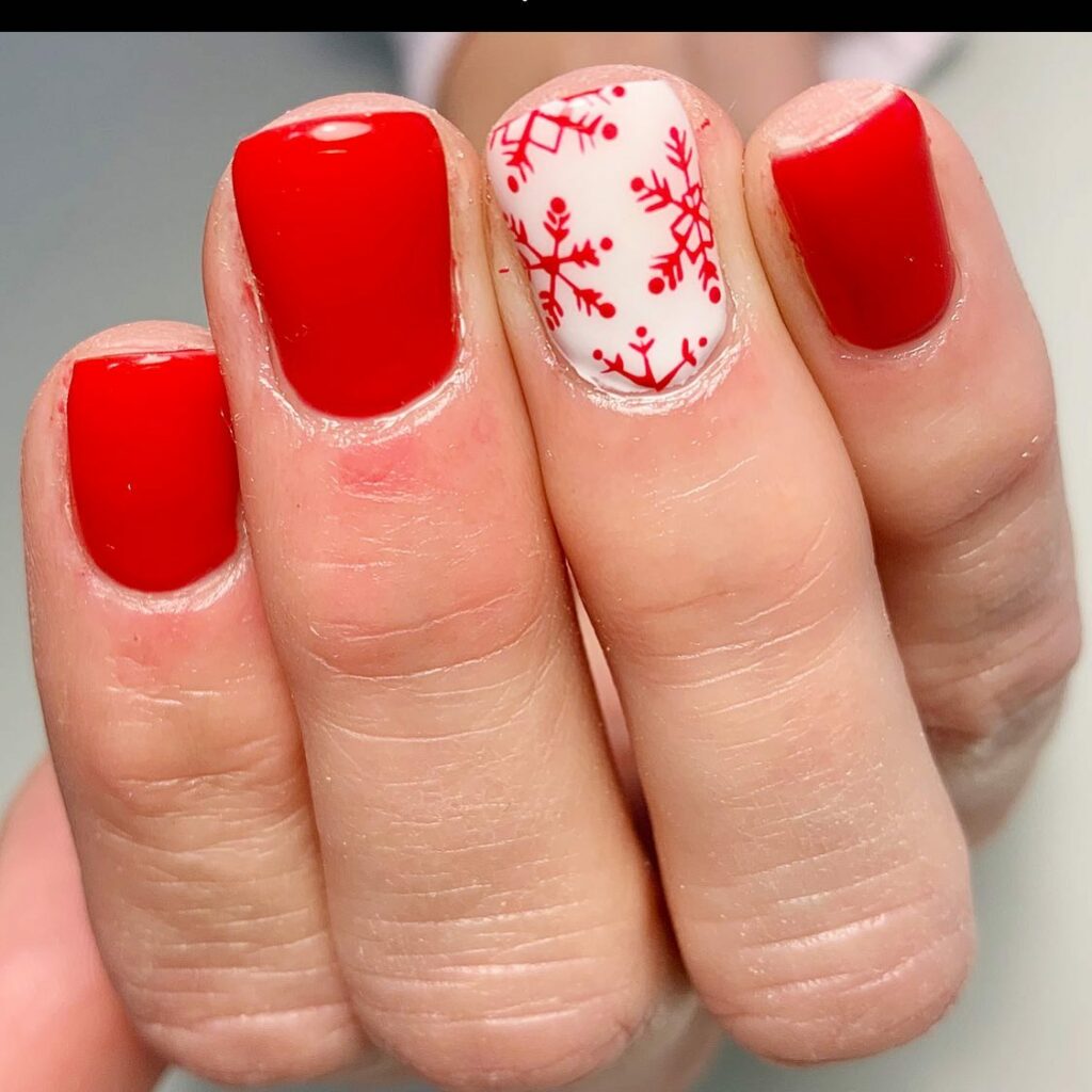 Red festive flurry Christmas nails with snowflake design