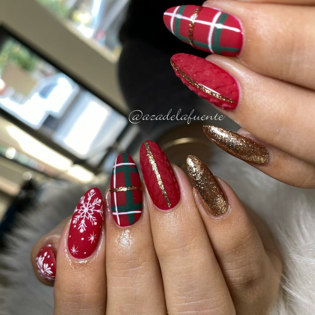 Whispers of winters charm in red and green Christmas nails with gold each nail a reflection of holiday wonders