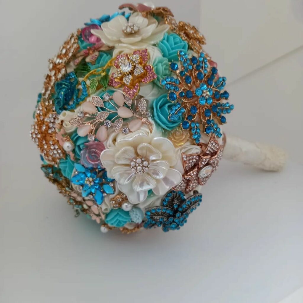 blue and green brooch bouquet with gold accent for summer wedding