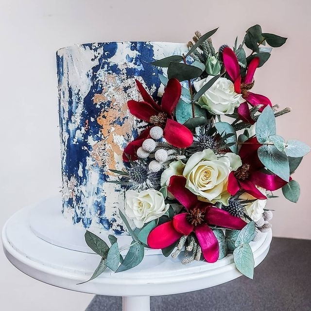 blue and vivid florals winter single tiered wedding cake