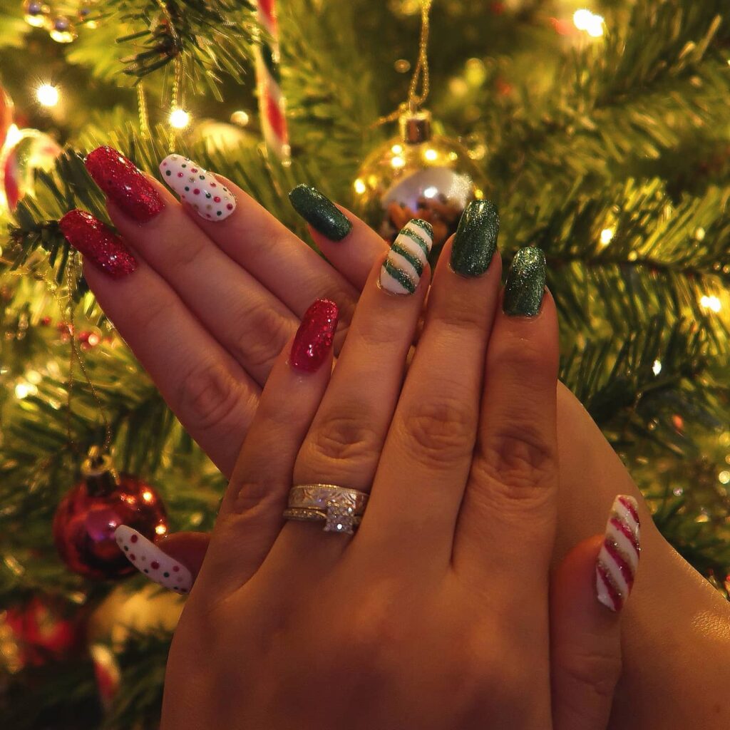 bright festive red and green glitters and the playful candy cane stripes all set against the warm backdrop of Christmas lights