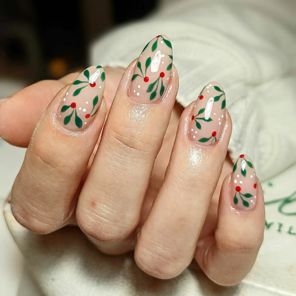 delicate greenery and red berries Christmas nails that bring to mind the gentle touch of winters natural beauty