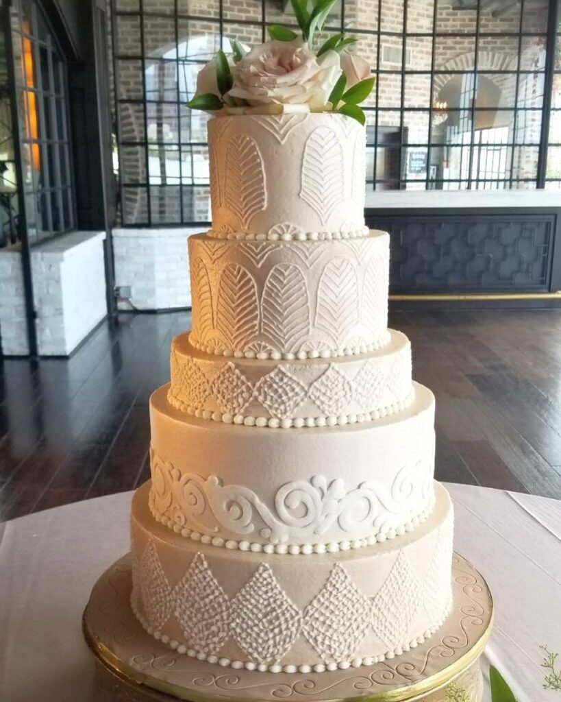 five tiered winter wedding buttercream cream cake with blush rose