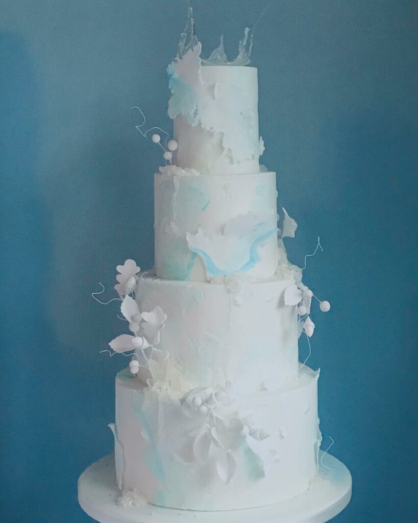 four tiered winter icy blue wedding cake