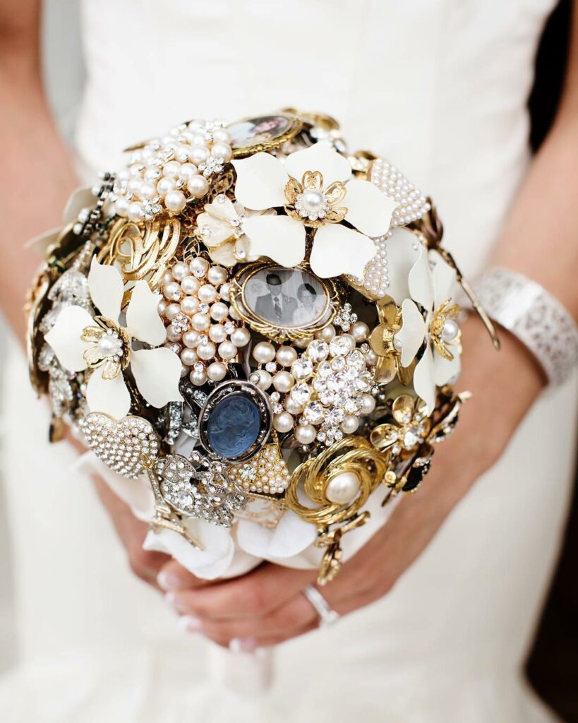 golden and silver brooch wedding bouquet with small photo inside