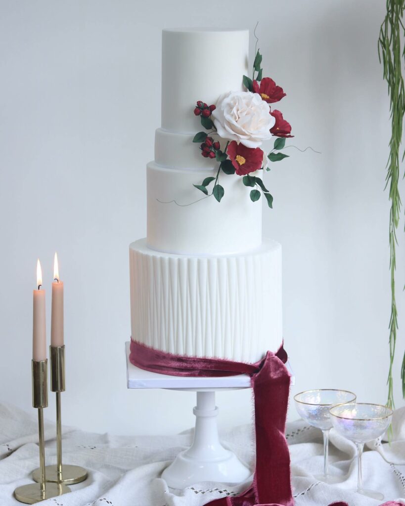 modern winter crimson wedding cake with velvet and florals