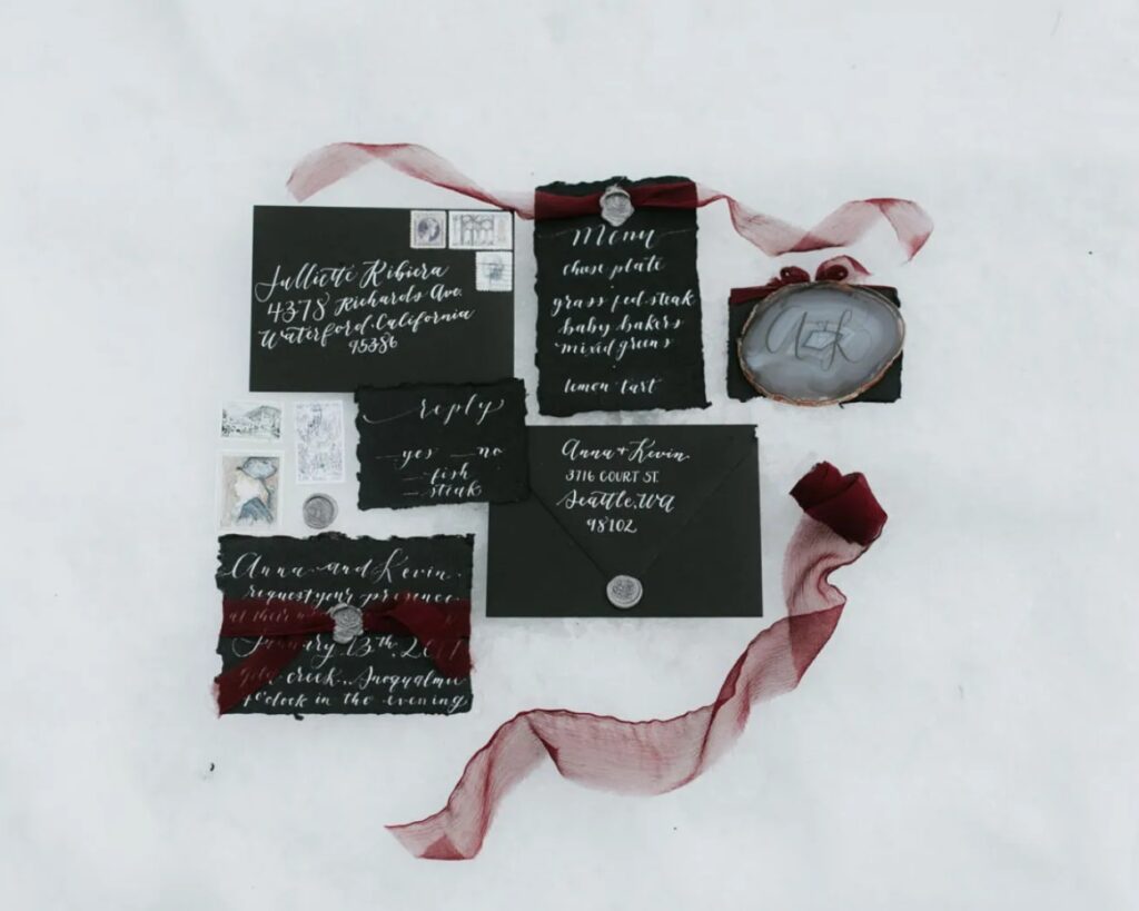 moody black and white with burgundy Christmas winter wedding invitation