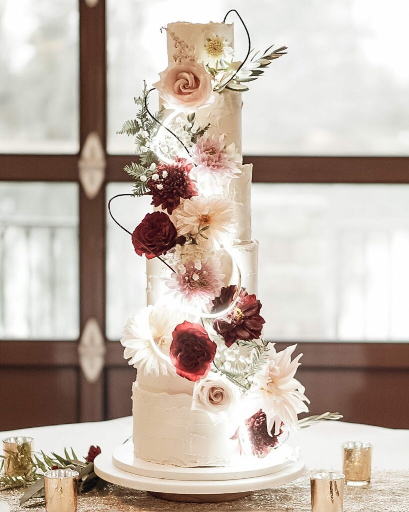 multitiered winter white wedding cake with fresh blooms