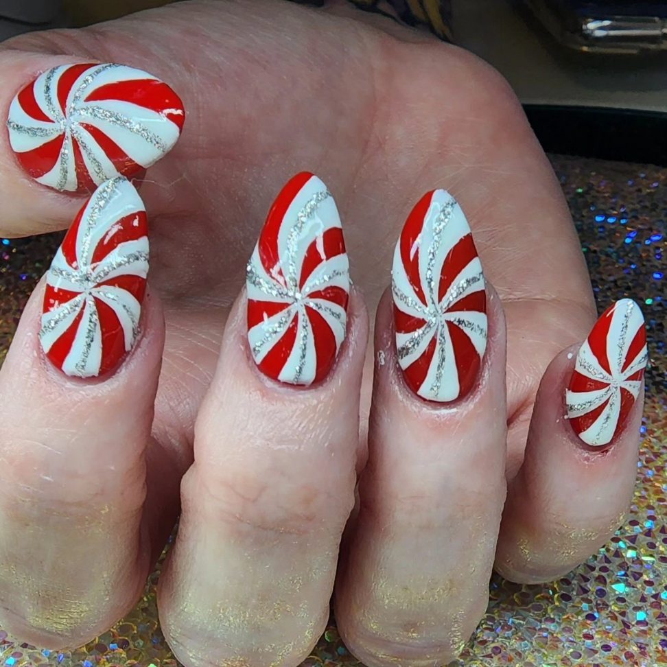red and white pattern yuletide Christmas nails
