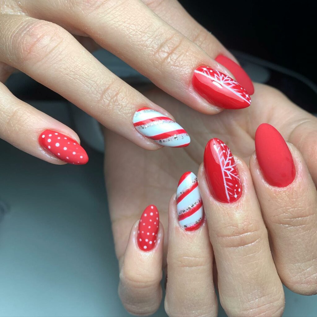 red and white playful polka dots and candy cane stripes paired with the elegant snowflake Christmas nails