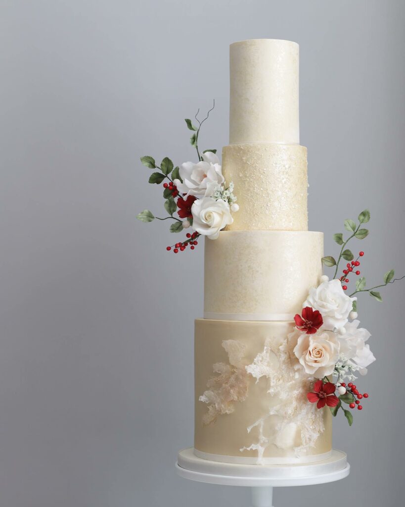 romantic sugar flowers winter wedding cake with traditional Christmas colors