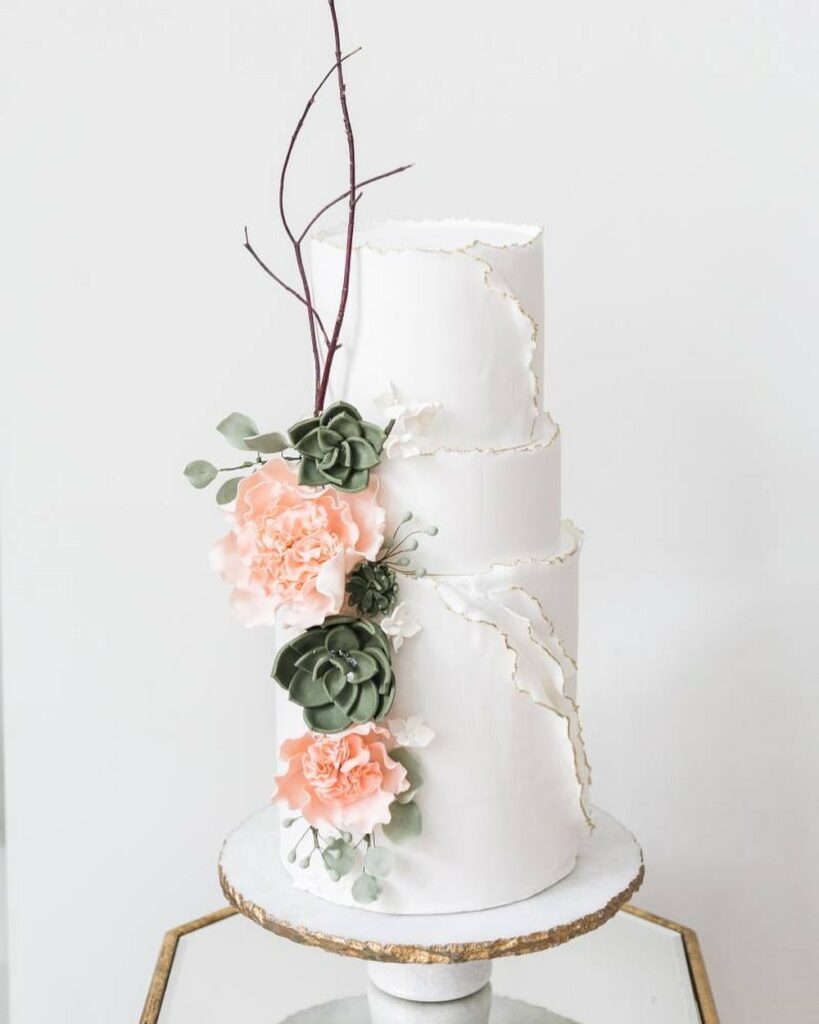 romantic winter white wedding cake with soft blooms
