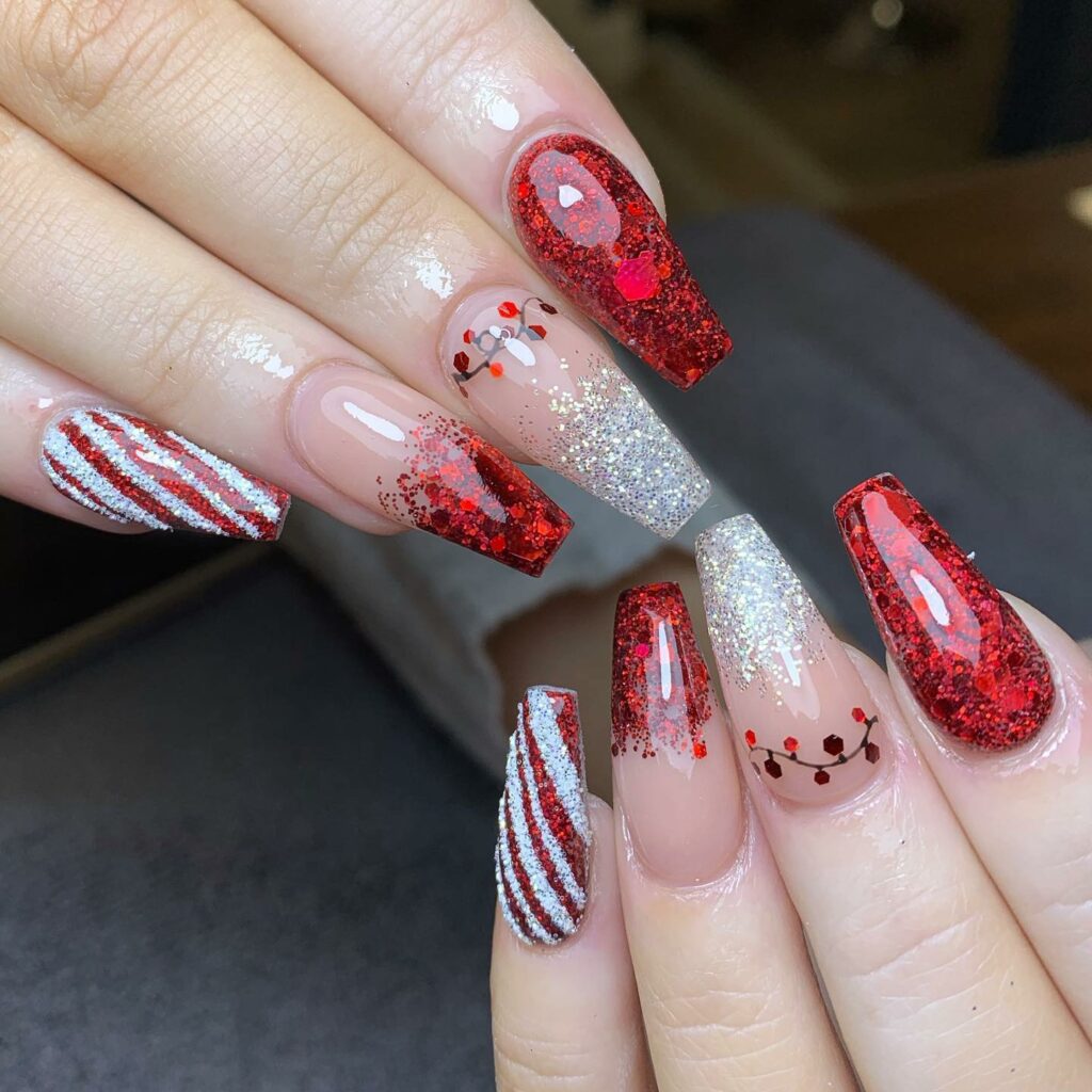 sparkling red glitter Christmas nails alongside the elegant white stripes
