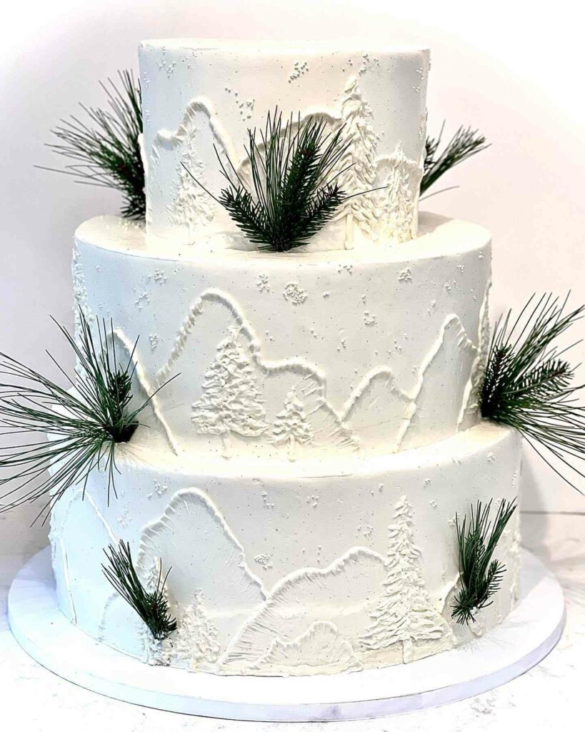 three tiered buttercream winter snow wedding cake