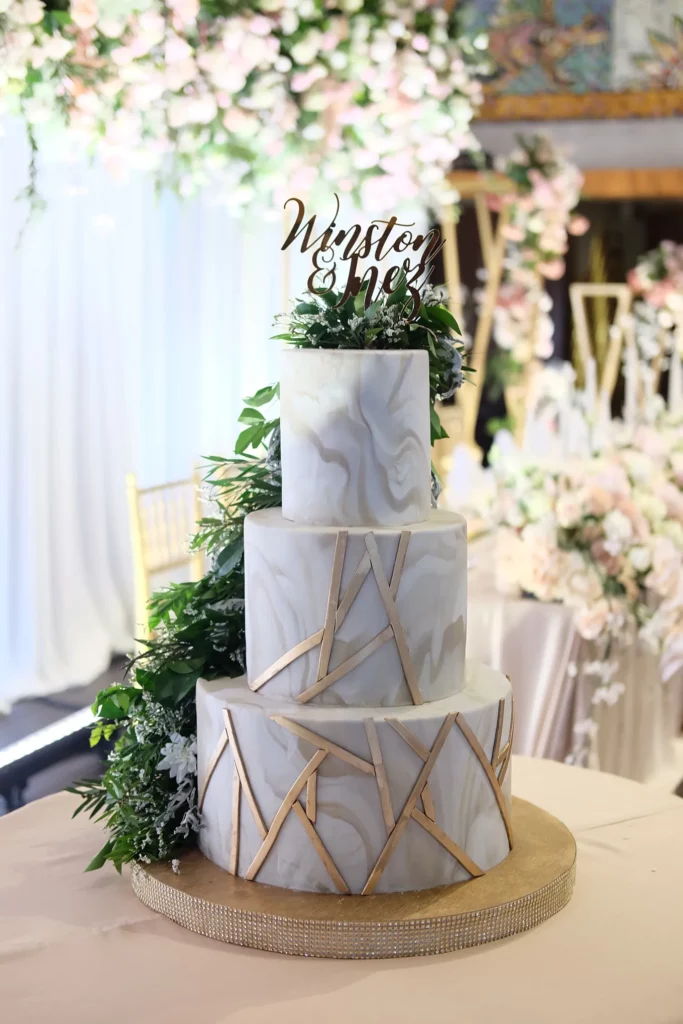 white and gold winter wedding marble cake